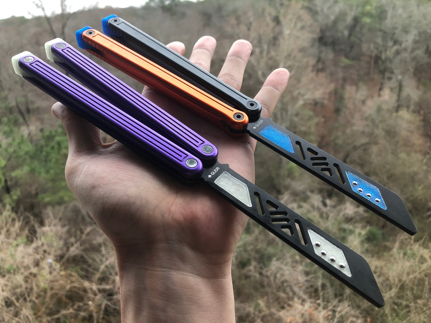 Reduce the handle bias and adjust the balance of your Glidr Arctic, Antarctic, and Bermuda balisong trainers with tungsten-weighted Zippy blade inserts and spacers featuring adjustable balance and positive jimping.