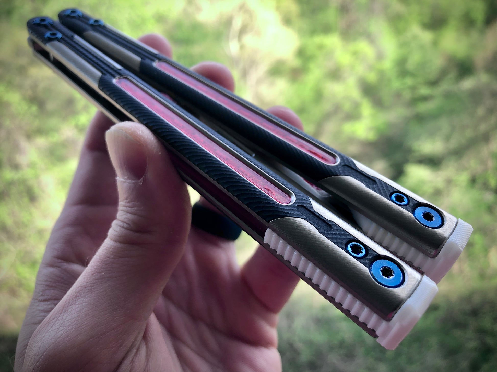 Adjust the balance, extend the handles, and add grip to your LDY balisong Cygnus and Orion flippers with Zippy extension spacers and handle inlays.