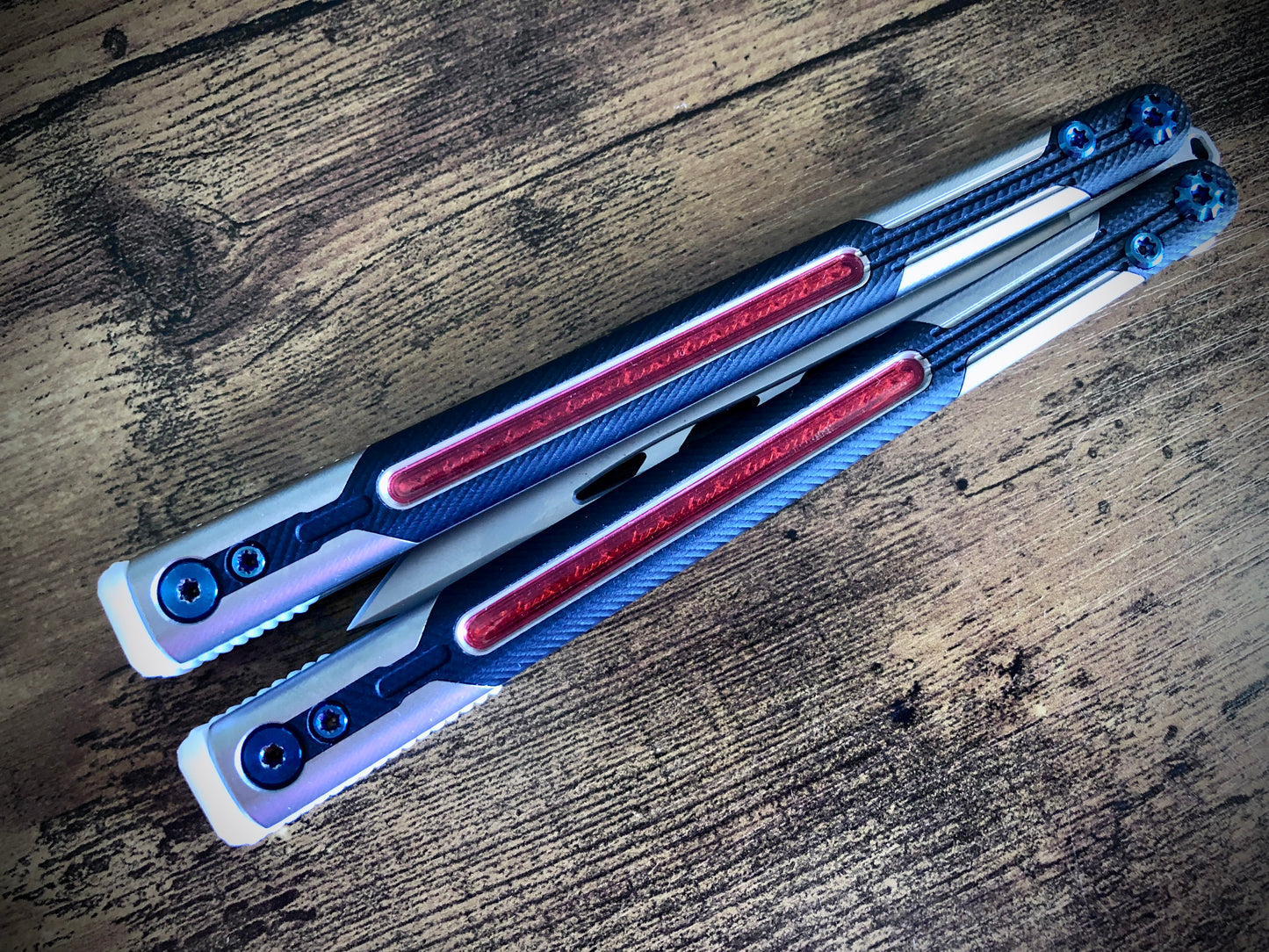 Adjust the balance, extend the handles, and add grip to your LDY balisong Cygnus and Orion flippers with Zippy extension spacers and handle inlays.